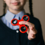 little-girl-with-add-adhdplaying-with-spinner