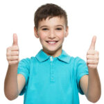 portrait-happy-teen-boy-showing-thumbs-up-gesture